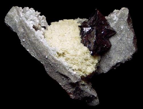Barite and Sphalerite on Dolomite

Elmwood Mine
Middle Tennessee District
Carthage
Smith County, Tennessee
United States of America

12.0 x 14.5 cm overall
7.5 cm Sphalerite (Author: GneissWare)
