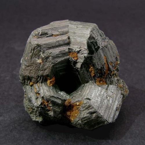 Rutile (twinned)
Magnet Cove, Hot Springs County, Arkansas, USA
Specimen size: 2.6 × 2.4 × 2.9 cm. 
Mined about 1956
Former Folch Collection
Photo: Reference Specimens

The perfect cyclic twin! From the classic Magnet Cove locality. (Author: Jordi Fabre)