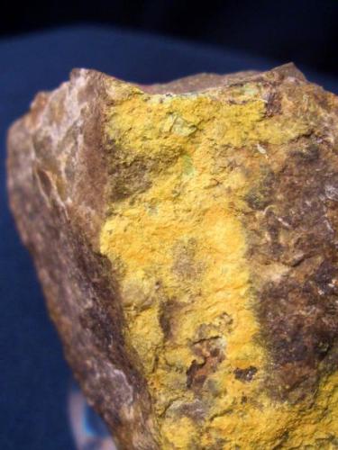 As is the case with most of my type locality minerals this is not real showy. The bright yellow crust is Pottsite from  Linka Mine, Spencer Hot Springs District, near Potts, Lander county, Nevada. The piece is about 1 1/8" x 1" (2.86 x 2.54 cm) (Author: Jim Prentiss)