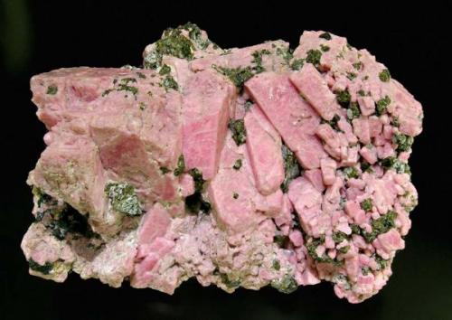 Rhodonite with Franklinite
Franklin, Sussex County, New Jersey  USA
Mined about 1970
Specimen size: 9.3 × 5 × 5.5 cm.
Main crystal size: 2.9 × 0.8 cm.
Former Folch Collection
Photo: Reference Specimens (Author: Jordi Fabre)