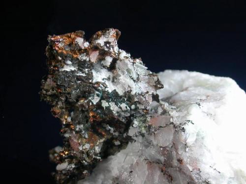 Copper in quartz.  
Pine Mountain, Adams Co., the mass of copper is about 3 cm across. (Author: John S. White)