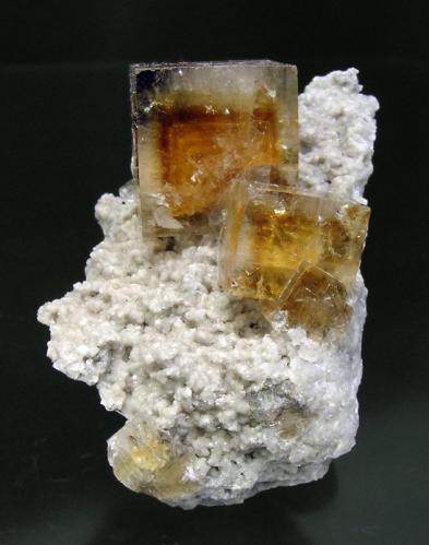 Fluorite with Celestine and Dolomite
White Rock Quarry, Clay Center, Ottawa County, Ohio, USA
Mined in 2007
Specimen size: 4.7 × 3.3 × 3.2 cm.
Main crystal size: 1.6 × 1.5 cm. 
Intense zoned fluorescence long & short UV
Photo: Reference Specimens (Author: Jordi Fabre)