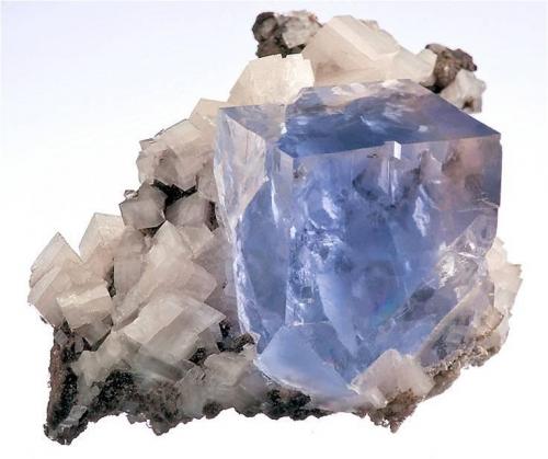 Light blue fluorite on Dolomite from Walworth, New York.  Measures 3.2 x 4.6 x 4 cm and weighs 40 grams. (Author: VRigatti)