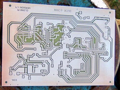 This shows you what a Home-made Printed Circuit board looks like before it is drilled and stuffed with electronic components. These boards are so easy to do it is scary! You start off with a circuit design printed on a clear plastic sheet, place the sheet over a copper board covered with photo resist (Riston) and exposure it to a source of UVA (or sun light), develop and then removed unwanted copper with etchant (ammonium persulphate). The end result is shown in the photo. And the holes are drilled to accept the parts. (Author: Lumaes)