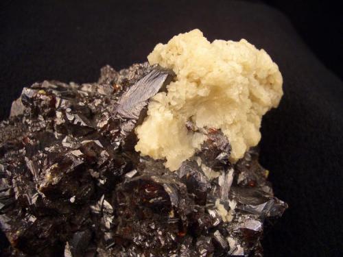 Here is both Barite (Strontian variety) and ruby jack Sphalerite from the Elmwood Mine, Carthage, Smith County, Tennessee. The feild of veiw is about 1 1/2" (3.81 cm). (Author: Jim Prentiss)