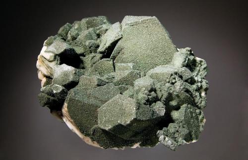 Albite var. pericline coated with chlorite 
Tilcon Quarry,  Acushnet, Massachusetts, USA  
5.6 x 7.2 cm. (Author: crosstimber)