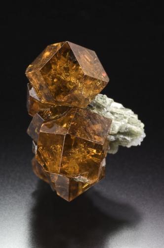 Grossular (variety Hessonite)
Belvidere Mountain Quarries (Eden Mills Quarries), Vermont, USA
Gail and Jim Spann Collection
1.3 x 1.9 x 1.1 cm.
Photo: Jeff Scovil

This State has a double honor, to be leaded by one image of the great Jeff Scovil as well as the fact that the image is of a specimen from Gail & Jim Spann Collection! ;-)
 Thank you so much to Jeff, Gail and Jim. The photo and the specimen deserves to lead this State. (Author: Jordi Fabre)