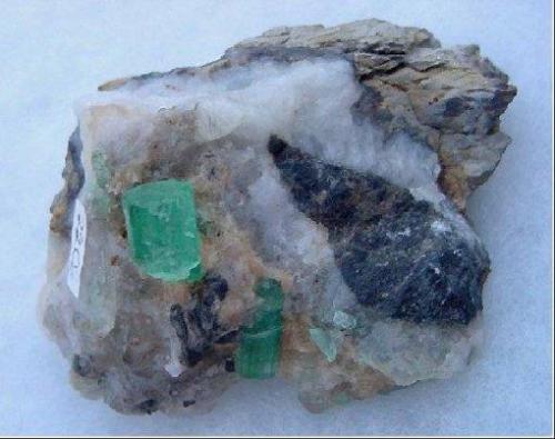 Emerald on calcite matrix
Muzo, Colombia.
Specimen size: 7 x 5 x 6 cm
Crystal size: 10 x 8 mm, 12 x 5 mm
Year: 2007 (Author: Leon56)