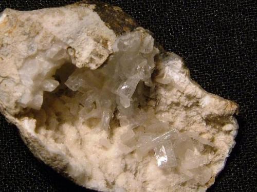 Epistilbite
Sgurr nam Boc, Isle of Skye, Scotland, UK
Crystals to 5 mm

Crystals to 5mm on quartz, with a little ?mordenite. The cavity is 23mm x 18mm. Self-collected in 1996 from Sgurr nam Boc, Isle of Skye. (Author: Mike Wood)