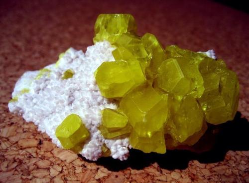 Sulphur. 
Cozzodisi Mine, Casteltermini, Agrigento Province, Sicily, Italy
Specimen size 80 x 50 x 50 mm. largest crystal ~25 mm. (Author: Tobi)