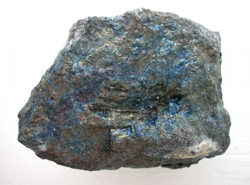 Massive berthierite with characteristic blue tarnish. 9 cm rich ore sample from Heinrich Stehender vein, 13th level, Alte Hoffnung Gottes mine, Kleinvoigtsberg near Freiberg, Saxony. (Author: Andreas Gerstenberg)