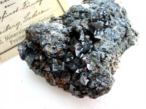 Glassy sphalerite crystals (Ag-bearing, so-called "verglaste Blende") from Himmelsfürst mine, Brand-Erbisdorf, Saxony. 7 cm sample with Bergakademie Freiberg label. (Author: Andreas Gerstenberg)