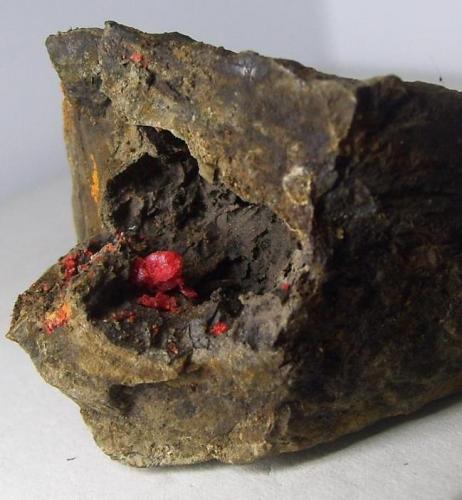 Rejalgar<br />La Soterraña Mine, South side of Mount Campusas, Pola de Lena, Lena, Comarca del Caudal, Principality of Asturias (Asturias), Spain<br />4 x 4 cm. (El cristal mide 0,4 cm.)<br /> (Autor: Darío Menéndez)