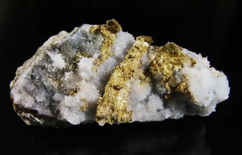 Oro Nativo s/Cuarzo.
Rosia Montana (ex-Verespatak), Alba, Transylvania, Rumanía.
7,1x3x1,5 cm.
Col. y foto Nacho Gaspar. (Autor: Nacho)