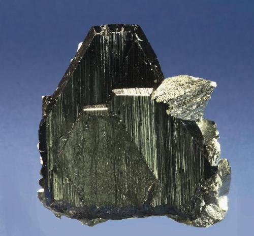 Ferberite with Arsenopyrite
Yaogangxian Mine, Yizhang, Chenzhou, Hunan, China 
Specimen Size: Cabinet

Specimen: William Pinch Collection
Photo: Jeff Scovil & The RRUFF Project (Author: Pinch Bill)