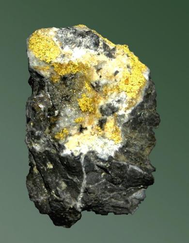 Oro
Barberton, Mpumalanga, R.S.A.  Sheba (m).
Agregados esponjosos en matriz (ejemplar de 1982).
3,5 x 2,5 x 1,7 cm. (Autor: Carles Curto)