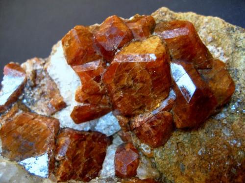 Grossular var. Hessonite.
Žulová, Olomouc Region, Moravia, Czech Republic.
105 x 95 x 50 mm, largest crystal 20 mm. (Author: Tobi)