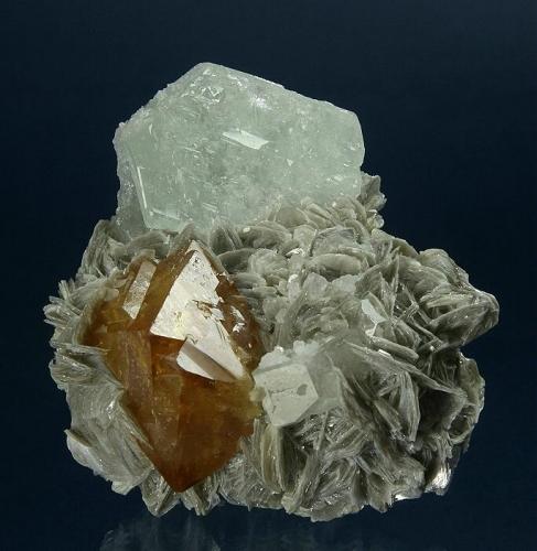 Scheelite and Beryl (v. Goshenite) on Muscovite
Mt. Xuebaoding, Pingwu County,  Mianyang Prefecture, Sichuan Province, China
71 x 67 x 50 mm overall
Largest beryl is 37 x 15 mm and Scheelite is 38 x 26 x 25 mm (Author: GneissWare)