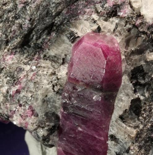 Corundum var. Ruby.
Mysore District, Karnataka, India.
50 x 45 x 40 mm, main crystal 25 mm long.

(Photo © by vendor and previous owner Klaus Krause) (Author: Tobi)