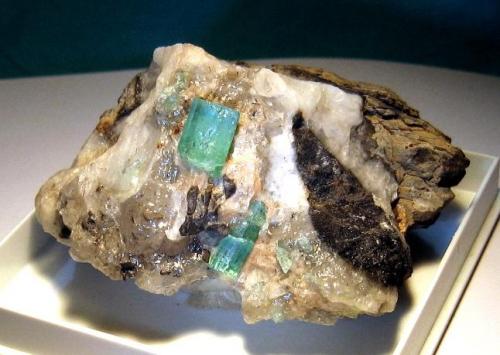 Beryl var. Emerald on calcite matrix
Emerald Mines in Muzo, Colombia
7 x 5 x 6 cm
 (Author: Leon56)