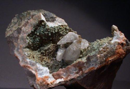 Calcite
Near Crystal Creek, Minnesota, USA
15 X 10 X 8 cm
A group of scalenohedral calcites, the largest is 4 cm, sitting in a vug of greenish quartz. Found by my son Greg in a rock slide at a road cut through the North Shore basalt. (Author: John Nash)