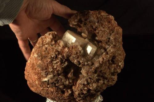 Calcite in laumontite
Near Beaver Bay, Lake County, Minnesota, USA
25 X 18 X 16 cm
Ex-Roland Quinn, proprietor of the Beaver Bay Agate Shop at the time. Roland inherited the shop and collection from his father. This incredible specimen has a group of flat-topped pseudohexagonal calcites in a large boulder of calcite and laumontite. It clearly was a piece of a large calcite vein that broke off. The miracle is that the whole specimen looks like a water-worn rock, but the calcite crystals are pristine and undamaged, showing no signs of wear at all. Greg theorizes this must have been in a part of Lake Superior with a sandy bottom. The usual pebble bottoms would have made short work of the calcite. The largest crystal is about 6 cm across. A true Minnesota classic, rare beyond rare. (Author: John Nash)