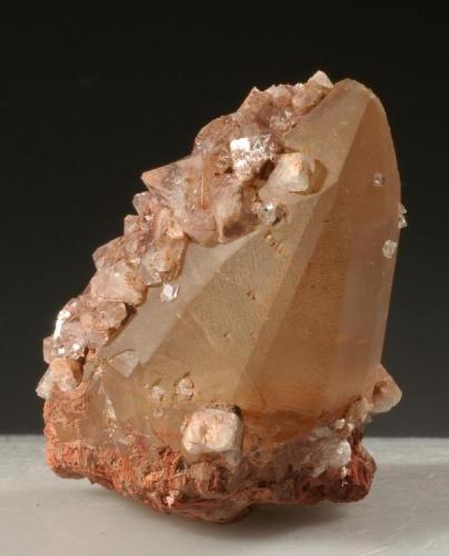 Apophyllite on calcite
Onion River, near Lutsen, Cook County, Minnesota, USA
6.5 X 4 X 4 cm
A fine calcite crystal with a number of clear apophyllites on it. (Author: John Nash)