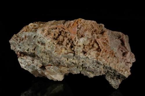 Prehnite
Knife River, St. Louis County, Minnesota, USA
19.5 X 10 X 10 cm approximately
This orange prehnite shows partial casts after laumontite, the largest cast is about 2 cm. The prehnite glitters with gold and some blue iridescence. (Author: John Nash)
