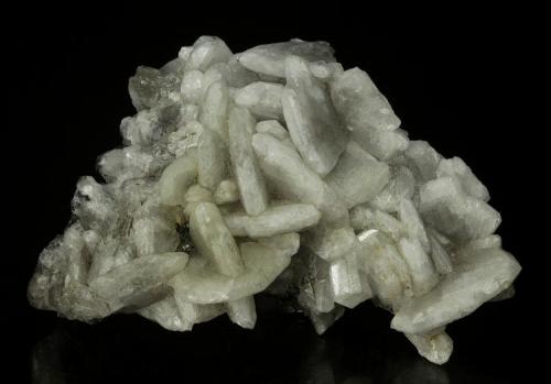 Barite
Warren District, Bisbee, Cochise County, Arizona, USA
75 x 60 x 37 mm

White blades of Barite form interlocking groups, with blades reaching 2.2 cm on edge.  These are quite rare. (Author: GneissWare)