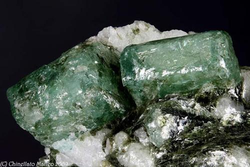Beryl var. Emerald
Pizzo Marcio, Trontano, Vigezzo Valley, Ossola Valley, Verbano-Cusio-Ossola Province, Piedmont, Italy
Group of two Emerald crystals of 9.25 and 10.34 mm (Author: Matteo_Chinellato)