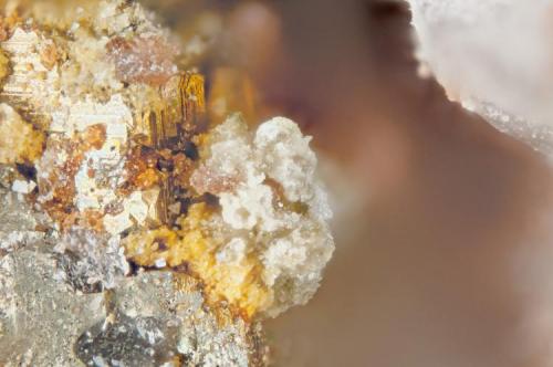 Celestine, Titanite, Pyrite
Poudrette quarry (Demix quarry; Uni-Mix quarry; Desourdy quarry; Carrière Mont Saint-Hilaire), Mont Saint-Hilaire, Rouville RCM, Montérégie, Québec, Canada
FOV=2mm
Celestine is fine mass of white and yellowish crystals and the titanite is the pink crystal masses. (Author: Doug)