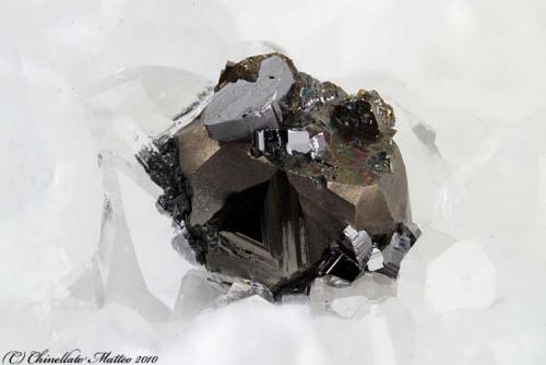 Pyrite, Enargite
Madielle Quarries, Massa, Apuan Alps, Massa-Carrara Province, Tuscany, Italy
2.23 mm Pyrite crystal with grey Enargite crystals in epitaxy (Author: Matteo_Chinellato)