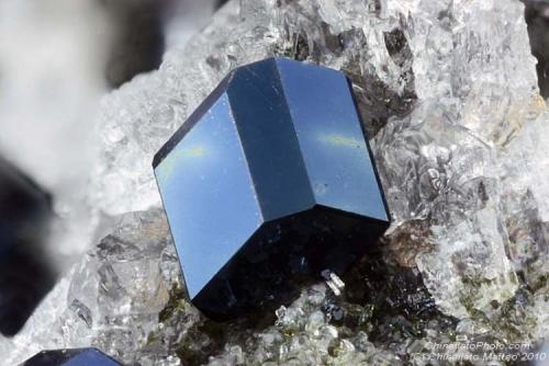 Andradite var. Melanite
Montenero quarry, Onano, Viterbo Province, Latium, Italy
1.06 mm blue Melanite tabular crystal (Author: Matteo_Chinellato)