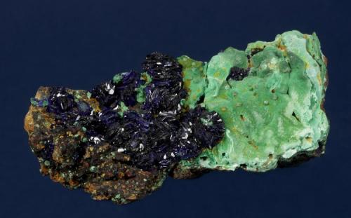 Azurite with Malachite
Copper Queen Mine, Warren District, near Bisbee, Cochise County, Arizona, USA
73 x 32 x 27 mm
Numerous, lustrous, dark blue Azurite rosettes to 10 mm cover half of the specimen. Light green Malachite completely covers the other half of the specimen. The specimen is circa 1957. Formerly in Tom Hales personal collection. (Author: GneissWare)