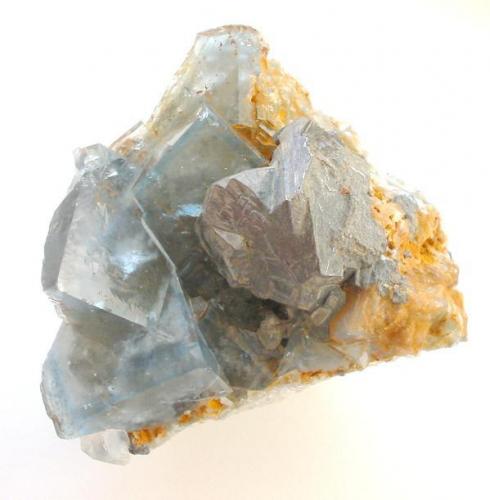Galena, fluorite
Beihilfe mine, Halsbrücke, Saxony, Germany
3,5 cm
Twinned galena aggregate on light blue fluorite crystals from 450 m level (Author: Andreas Gerstenberg)