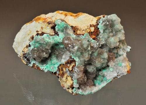 Hemimorphite with Cuprite and Aurichalcite inclusions
Sunshine #4 tunnel, Blanchard Claims, Bingham, Socorro County, New Mexico, USA
8.9 x 7.6 cm
Ray Demark indentified the reddish colored inclusions as being cuprite (Author: Philip Simmons)
