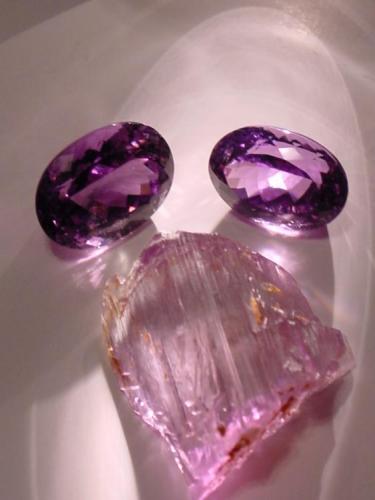 Spodumene, var. Kunzite,
Oceanview Mine, Pala, San Diego Co., California, USA
faceted stones of 32 and 35 carats;crystal is 4.0 cm long. (Author: Chris Wentzell)