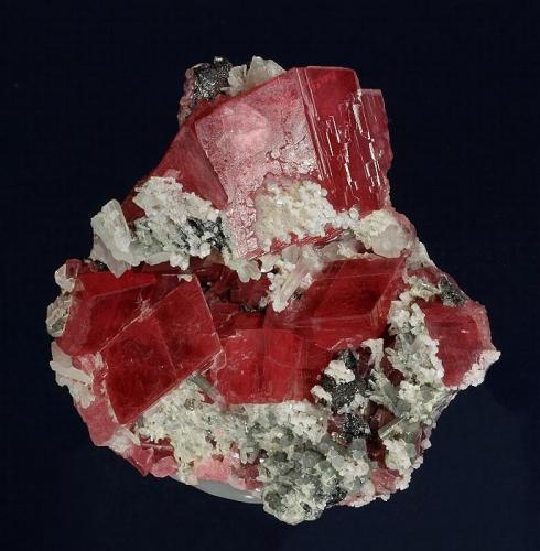 Rhodochrosite with Apatite
Sweet Home Mine, Alma District, Buckskin Gulch, Park County, Colorado, USA
72 x 70 x 32 mm
Largest rhomb is 26 mm (Author: GneissWare)