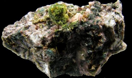 Pumpellyita
Monte La Rocha, Torás, Castellón, Comunidad Valenciana, España.
43 x 26 x 28 mm.
Piña de cristales de 6 mm. diametro (Autor: José Luis Zamora)