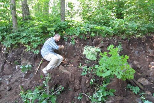 _A casually dressed collecting chum getting an image just after the excavator levered off a block of dolostone. (Author: vic rzonca)