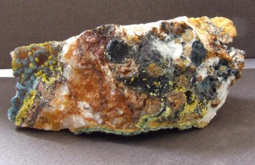 Plumbogummite, Mimetite, Quartz, Limonite and  Manganese Oxides
Dry Ghyll, Caldbeck Fells, Cumbria.
85 x 30 mm (Author: nurbo)