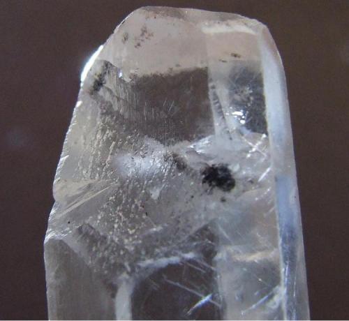 Calcite + ?
Stank Mine near Barrow in Furness,Cumbria
FOV sapprox 15 x 15 mm 
What an interesting termination this crystal has. (Author: nurbo)