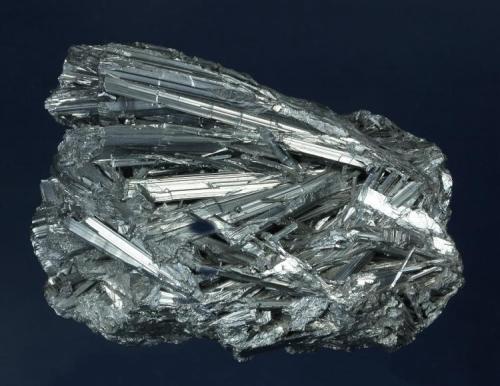 Stibnite

Ichinokawa Mine, Saijo, Ehime Prefecture, Shikoku, Japan

99.0 x 69.0 x 44.0 mm

This is a complex group of parallel to sub-parallel crystals of Stibnite to 57 mm, forming a nice 3-dimensional specimen from this famous Japanese locality. The Stibnite is of classic form and gun-metal gray in color. Collected circa 1879, it was previously in the Harvard University collection, and a Trafford-Flynn specimen. No damage. (Author: GneissWare)