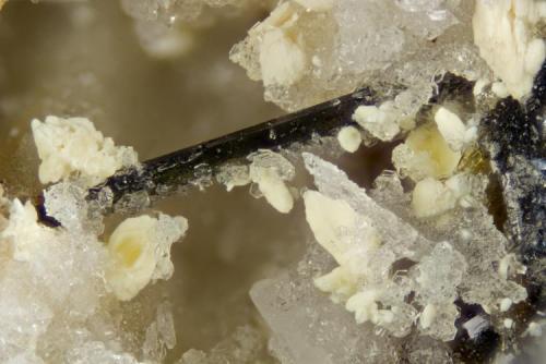 Griceite
Poudrette quarry (Demix quarry; Uni-Mix quarry; Desourdy quarry; Carrière Mont Saint-Hilaire), Mont Saint-Hilaire, Rouville RCM, Montérégie, Québec, Canada
FOV=3mm
Griceite is the beige clusters (Author: Doug)