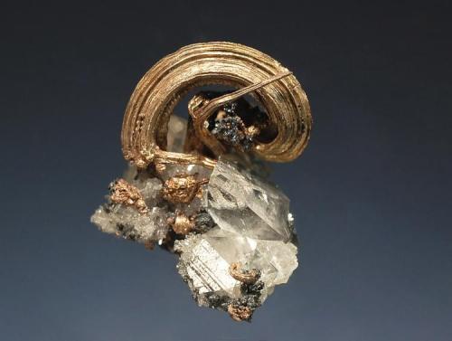Silver
Guanajuato, Guanajuato, Mexico
2.0 x 2.6 cm
I like how the small calcite rhombs accent this wire silver. (Author: crosstimber)