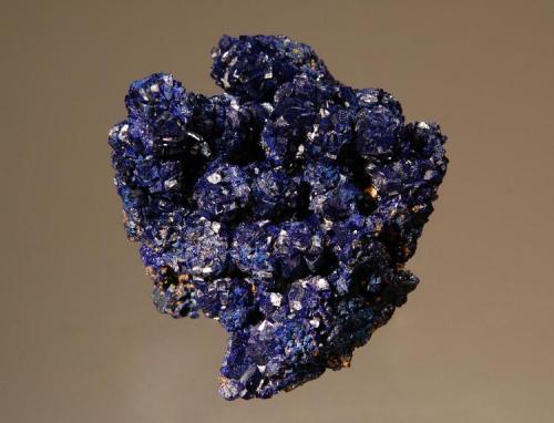 Azurite
Morenci Mine, Shannon Mts., Greenlee Co., Arizona
5.5 x 6.2 cm.
Aggregates of azurite rosettes to 1.0 cm. (Author: crosstimber)