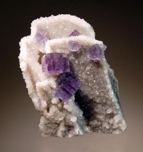 Fluorite
La Viesca Mine, Huergo, La Collada, Asturias Prov., Spain
5.5 x 9.0 cm
Cubic fluorite on quartz casts after barite. Collected in December 2001. (Author: crosstimber)