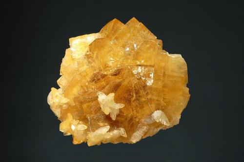 Fluorite
Moscona Mine, Villabona, Asturias Prov., Spain
7.1 x 7.7 cm.
Cubic fluorite with small calcite crystals. (Author: crosstimber)
