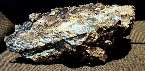 Native Silver in Bornite
Coleman Mine, Levack, Ontario, Canada
12 x 4.5 x 3 cm
Native silver in bornite from Sudbury is typically formed in thin sheets along joint contacts within bornite veins. These high copper veins are found in the foot wall rocks away from the nickel ore bodies that are commonly mined here. (Author: Joseph D'Oliveira)