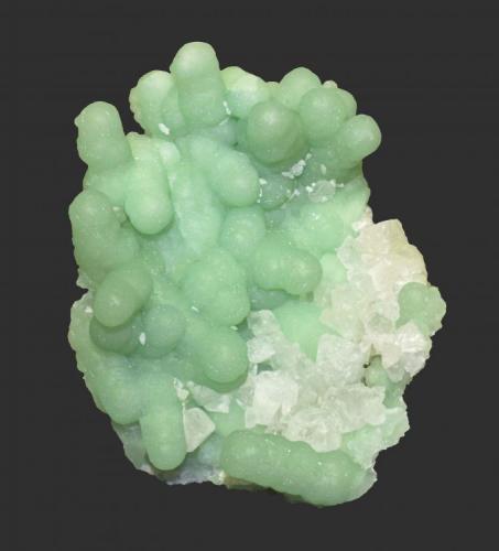 Prehnite and calcite
McBride Avenue and Browertown Road Pumping Station, Woodland Park, Passaic Couny, New Jersey, USA
12 x 10 cm
From an excavation in 1986 which produced countless numbers of specimens of prehnite after anhydrite with a look different from those of other nearby localities. (Author: Frank Imbriacco)